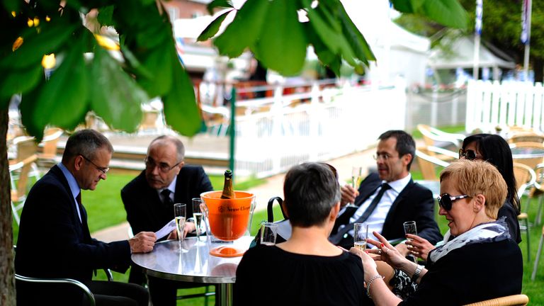YORK, ENGLAND - MAY 15: Enjoying a bottle of champagne before racing at York racecourse on May 15, 2014 in York, England. (Photo by Alan Crowhurst/Getty Im