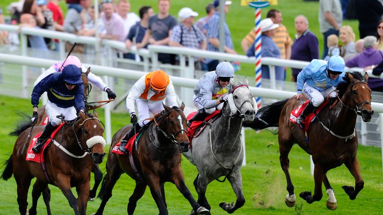 YORK, ENGLAND - MAY 15:  Kieren Fallon riding Navajo Chief (C, orange cap) win The Betfred Hambleton Stakes at York racecourse on May 15, 2014 in York, Eng