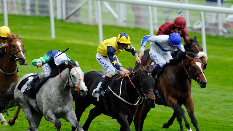 YORK, ENGLAND - MAY 15: William Twiston-Davies riding Bossy Guest (blue cap) win TheEBF Stallions Maiden Stakes at York racecourse on May 15, 2014 in York,
