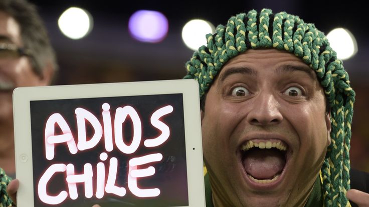 A fan shows a sign during the Round of 16 football match between Colombia and Uruguay at the Maracana Stadium in Rio de Janeiro 