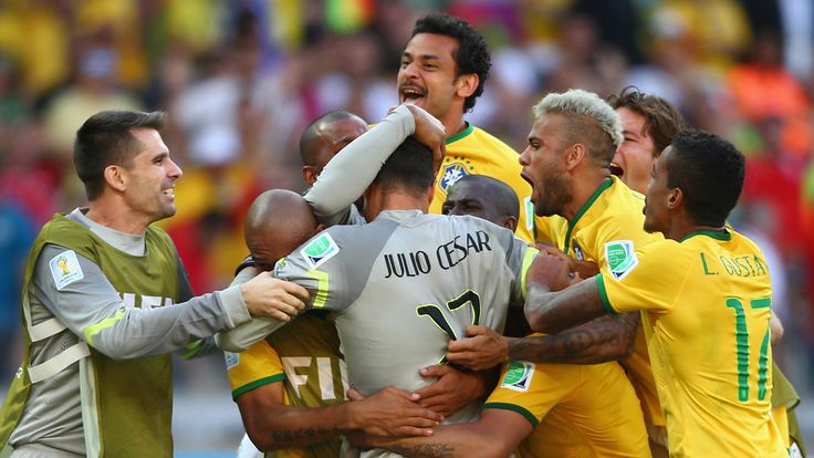 Julio Cesar of Brazil celebrates with teammates after defeating Chile in a penalty shootout