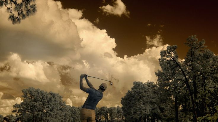 Martin Kaymer of Germany hits his tee shot on the 17th tee during the US Open