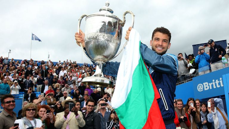 - Grigor Dimitrov of Bulgaria celebrates with the winners trophy after defeating Feliciano Lopez of Spain during their Mens Singles Final