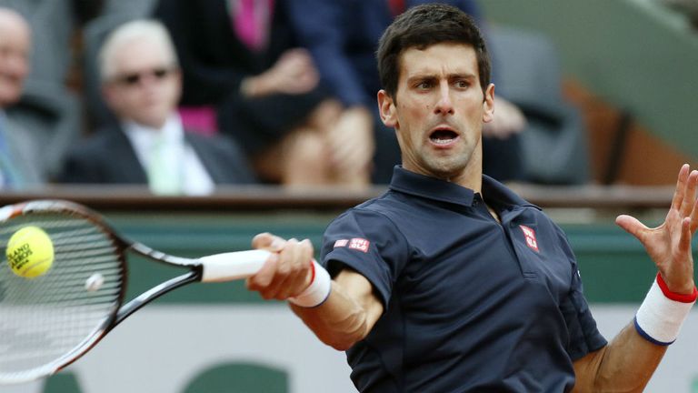 - Serbias Novak Djokovic hits a return to Canadas Milos Raonic during their French tennis Open quarter-final match at Roland Garros