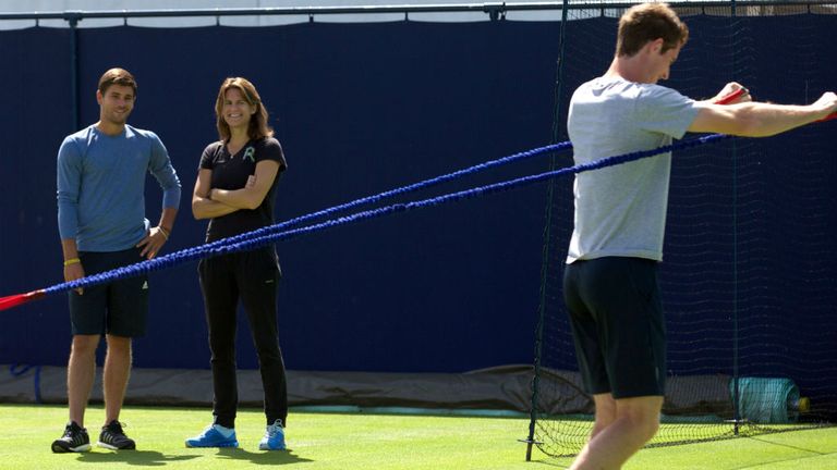 Andy Murray trains as his newly-appointed French coach Amelie Mauresmo (C) looks on