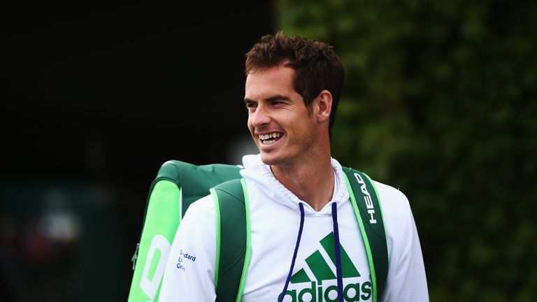 Andy Murray walks out to start a practice session on day four at Wimbledon