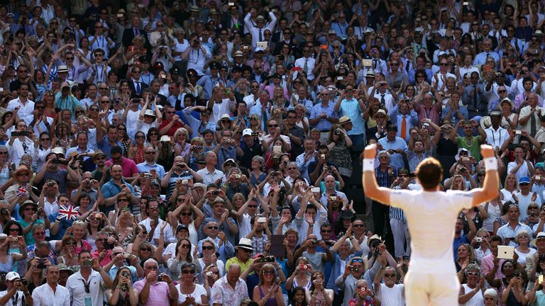 Fans cheer and take photographs as Andy Murray celebrates victory in the final against Novak Djokovic