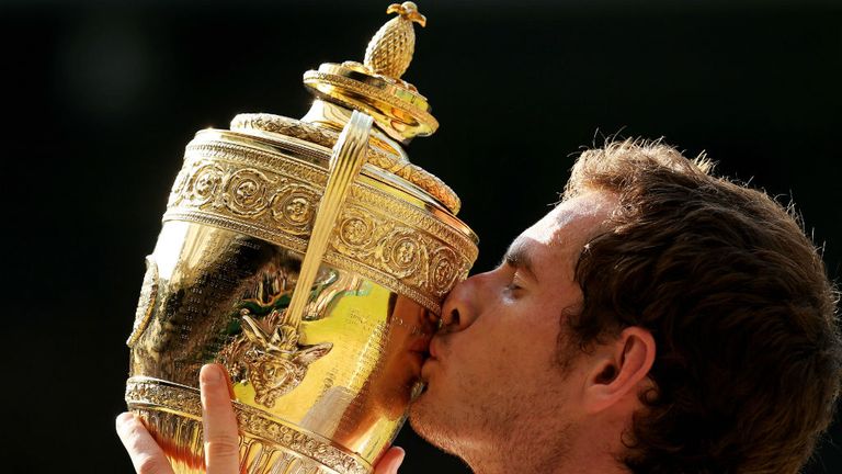Andy Murray kisses the Gentlemen's Singles Trophy following his victory against Novak Djokovic 