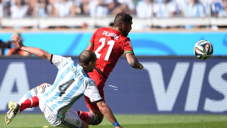 Argentina's defender Pablo Zabaleta (L) and Iran's forward Ashkan Dejagah vie during the Group F football match between Argentina and Iran.