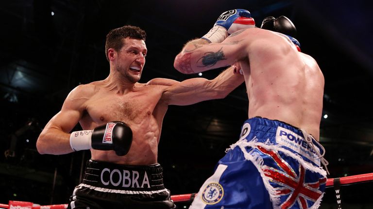 Carl Froch (left) punches George Groves during the IBF and WBA World Super Middleweight Title fight at Wembley Stadium, London.