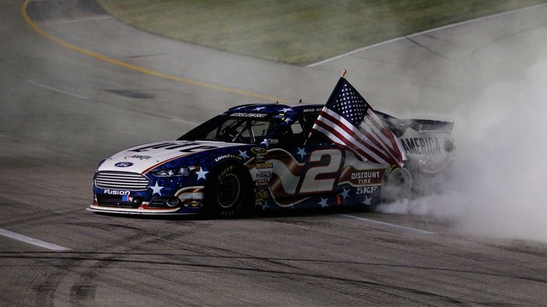 Brad Keselowski celebrates with a burnout after winning the NASCAR Sprint Cup Series race