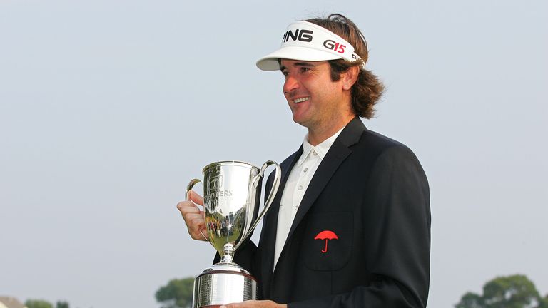Bubba Watson holds the trophy after winning a three-way two-hole playoff after the final round of the Travelers Championship