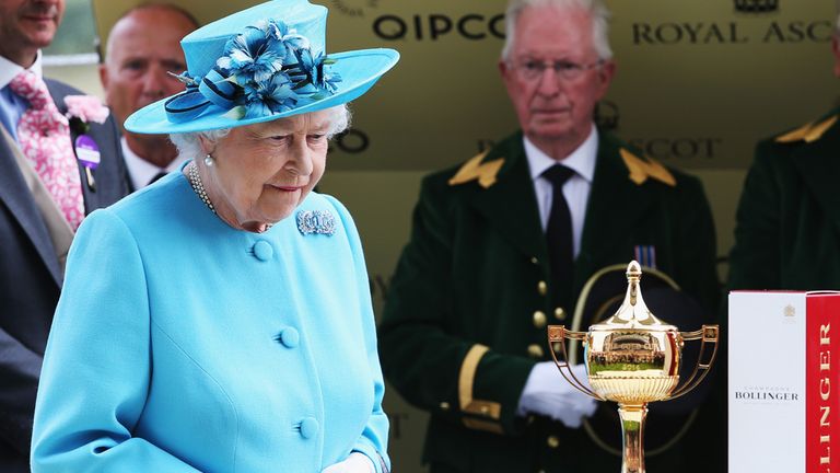 ASCOT, ENGLAND - JUNE 19:  Queen Elizabeth II prepares to present the Gold Cup after her horse Estimate came 2nd in the Gold Cup behind the winner Leading 