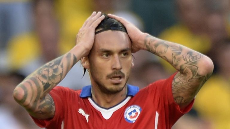 Chile forward Mauricio Pinilla reacts after missing a shot on goal during extra-time in the World Cup clash v Brazil