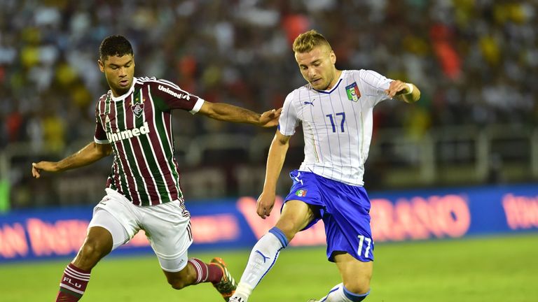 Italy's forward Ciro Immobile (R) vies with Fluminense's defender Ailton during a friendly football match between Fluminense and Italy at the Raulino de Ol