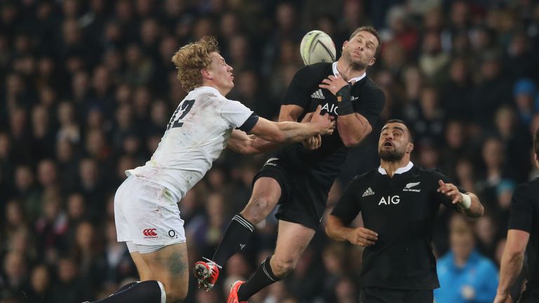 Cory Jane of New Zealand is challenged to the high ball by England centre Billy Twelvetrees during the second Test in Dunedin