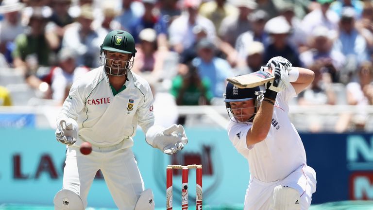 CAPE TOWN, SOUTH AFRICA - JANUARY 07:  Ian Bell of England hits out as Mark Boucher of South Africa looks on during day five of the third test match betwee