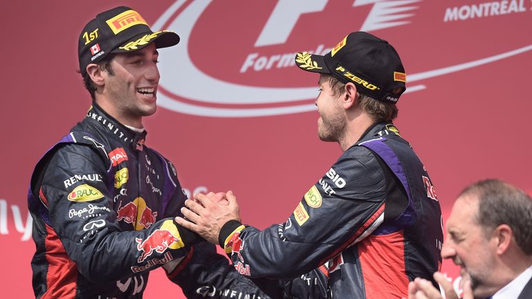 Daniel Ricciardo is congratulated by Sebastian Vettel