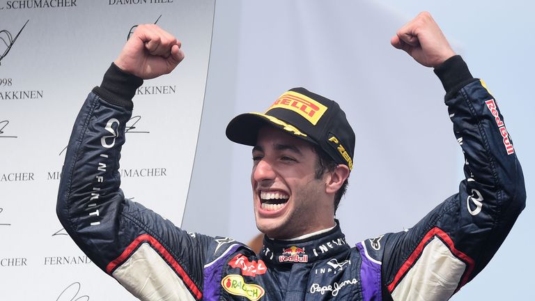 Daniel Ricciardo celebrates on the podium 