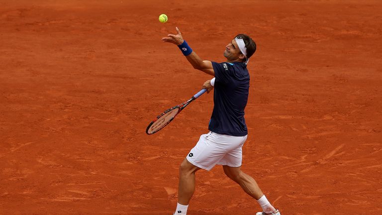 David Ferrer of Spain serves during his men's singles match against Kevin Anderson of South Africa on day nine of the French Open