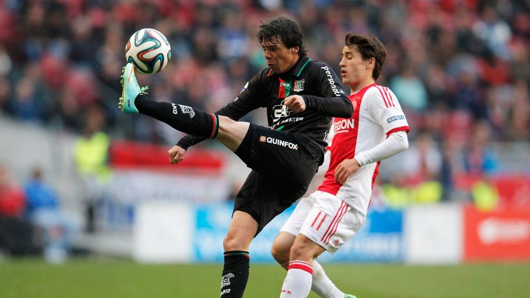 AMSTERDAM, NETHERLANDS - MAY 03:  Bojan Krkic of Ajax and Jeffrey Leiwakabessy of NEC battle for the ball during the Eredivisie match between Ajax Amsterda