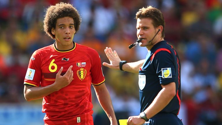 RIO DE JANEIRO, BRAZIL - JUNE 22: Axel Witsel of Belgium is shown a yellow card by referee Felix Brych during the 2014 FIFA World Cup Brazil Group H match 