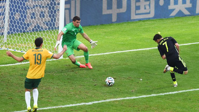 CURITIBA, BRAZIL - JUNE 23:  David Villa of Spain scores his team's first goal with a back heel past Mathew Ryan of Australia during the 2014 FIFA World Cu