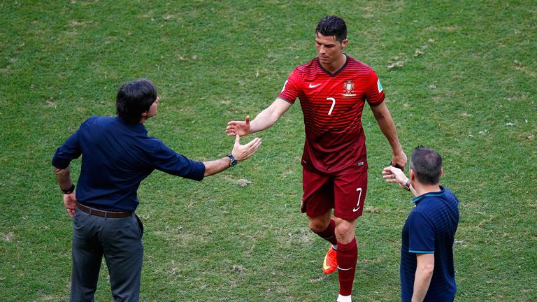 SALVADOR, BRAZIL - JUNE 16: Head coach Joachim Loew of Germany (L) shakes hands with Cristiano Ronaldo of Portugal as he leaves the field after the 2014 FI