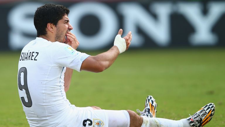 NATAL, BRAZIL - JUNE 24:  Luis Suarez of Uruguay reacts after a clash during the 2014 FIFA World Cup Brazil Group D match between Italy and Uruguay