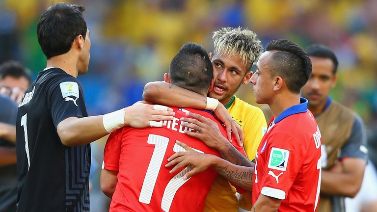 Neymar of Brazil hugs Gary Medel of Chile