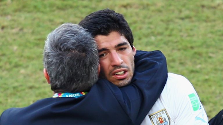 NATAL, BRAZIL - JUNE 24:  Head coach Oscar Tabarez of Uruguay hugs Luis Suarez after a 1-0 victory over Italy during the 2014 FIFA World Cup Brazil Group D