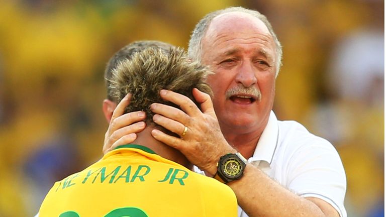 Head coach Luiz Felipe Scolari of Brazil celebrates with Neymar after defeating Chile in a penalty shootout