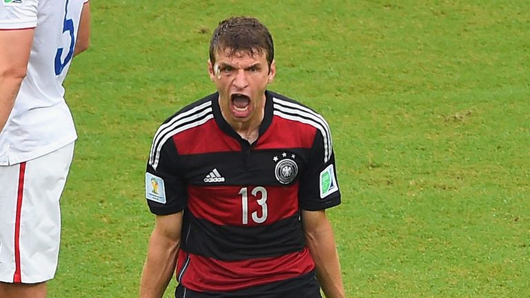 RECIFE, BRAZIL - JUNE 26: Thomas Mueller of Germany celebrates scoring his team's first goal as Matt Besler of the United States looks on during the 2014 F
