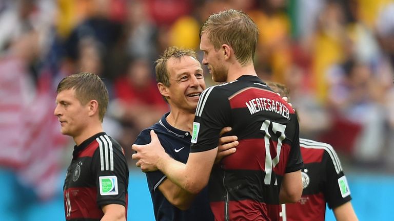 RECIFE, BRAZIL - JUNE 26: Head coach Jurgen Klinsmann of the United States speaks to Per Mertesacker of Germany after Germany's 1-0 win during the 2014 FIF
