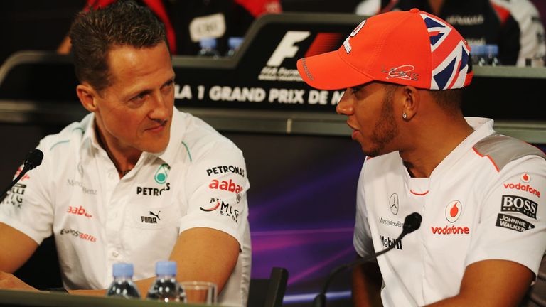 MONTE CARLO, MONACO - MAY 23:  Lewis Hamilton (R) of Great Britain and McLaren talks with Michael Schumacher (L) of Germany and Mercedes GP at the drivers 