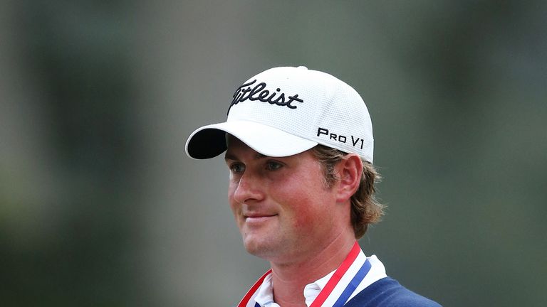 Webb Simpson of the United States poses with the trophy after his one-stroke victory at the 112th U.S. Open