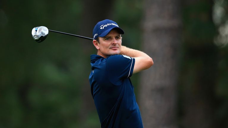 Justin Rose of England hits his tee shot on the 11th hole