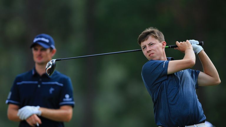 Amateur Matthew Fitzpatrick of England watches a tee shot as Justin Rose of England looks on during the first round of the 114th 