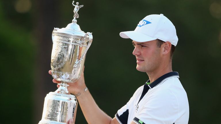 Martin Kaymer of Germany celebrates with the trophy after his eight-stroke victory during the final round of the 114th U.S. Open 