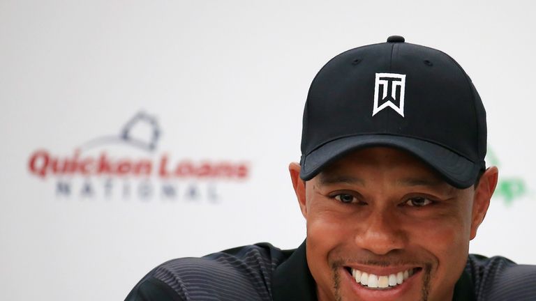 Tiger Woods talks with the media during a news conference at Congressional