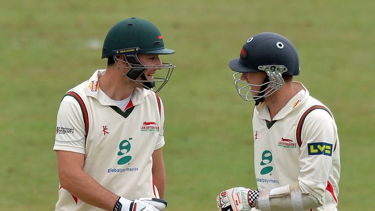 Leicestershire's Greg Smith (L) and Angus Robson (R) talk on the third day of the cricket Tour Match between 
