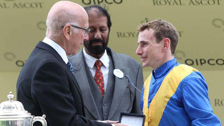 Sir Bobby Charlton shares a joke with Ryan Moore