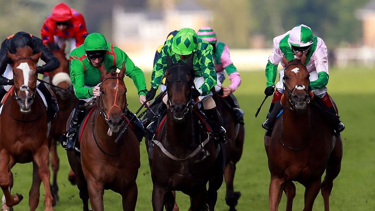 Louis the Pious ridden by Silvestre De Sousa  (right green diamond) on their way to victory in the Buckingham Palace Stakes during Day Four of the 2014 Roy