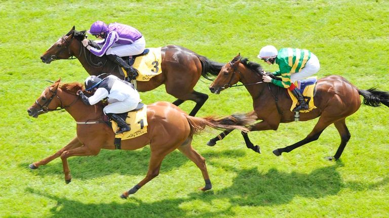 Accepted ridden by Wayen Lordan (bottom) goes on to win The Dubai Duty Free EBF Maiden during day two the Dubai Duty Free Irish Derby Festival at Curragh R