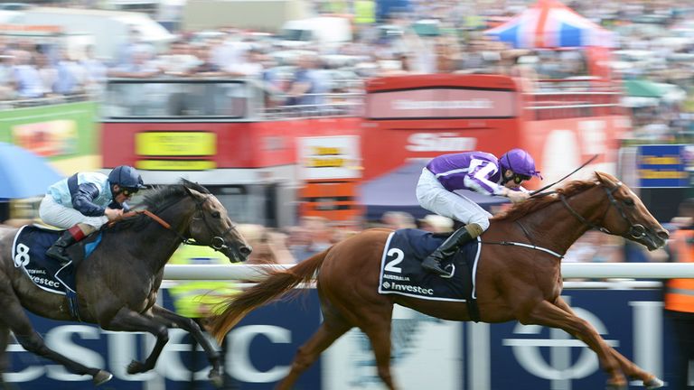 Australia ridden by Joseph O'Brien (right) wins the Investec Derby from Kingston Hill ridden by Andrea Atzeni (left)  at Epsom Downs Racecourse, Surrey. PR