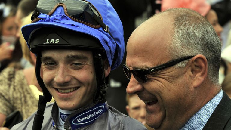 Jockey George Chaloner and trainer Richard Fahey after their victory with Angel Gabrial in the John Smiths Northumberland Plate during the John Smith's Nor