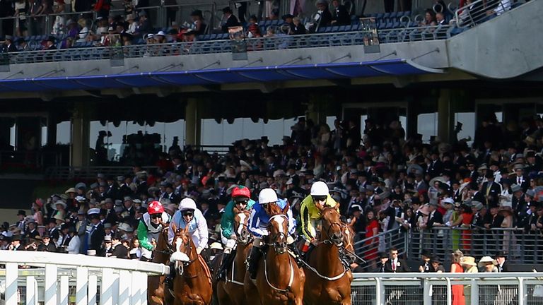 ASCOT, ENGLAND - JUNE 20:  A general view of race goers watching riders during day four of Royal Ascot 2014 at Ascot Racecourse on June 20, 2014 in Ascot, 