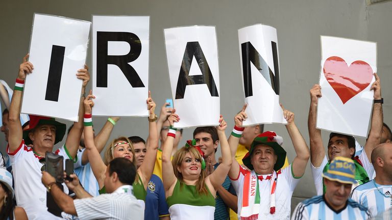 Iran fans cheer prior to the Group F football match between Argentina and Iran at the Mineirao Stadium