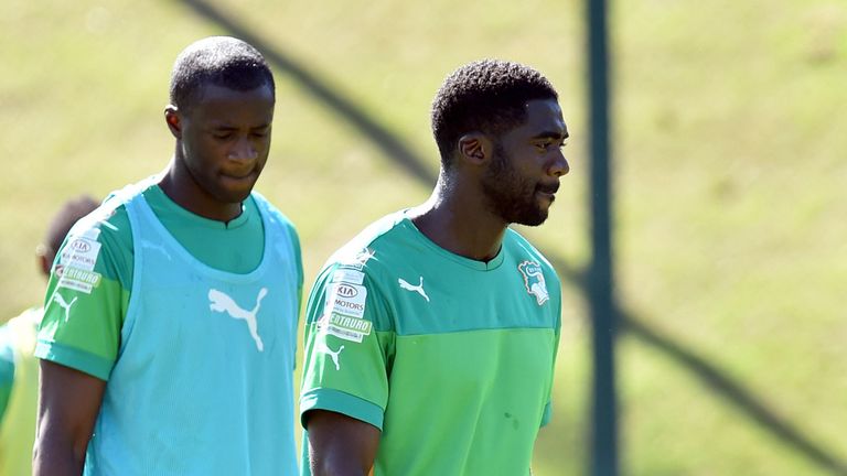 Ivory Coast's midfielder Yaya Toure and Ivory Coast's defender Kolo Toure take part in a training session in Aguas de Lindoia, Brazil