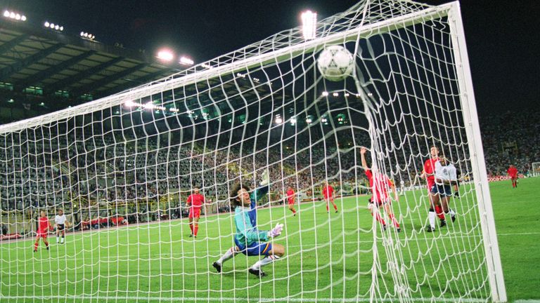 26 Jun 1990:  John Barnes of England (L) shoots past Michel Preud'homme of Belgium, but the goal is ruled out for offside during the FIFA World Cup Finals 